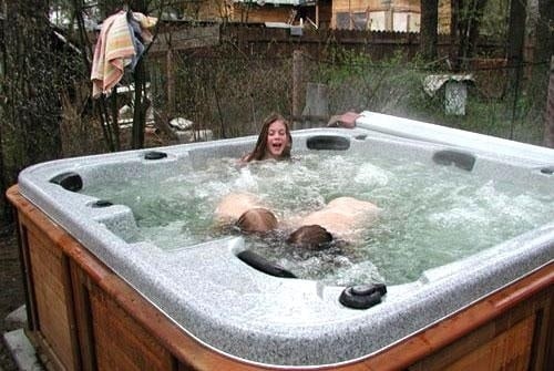 Kids playing in an Arctic Spas hot tub