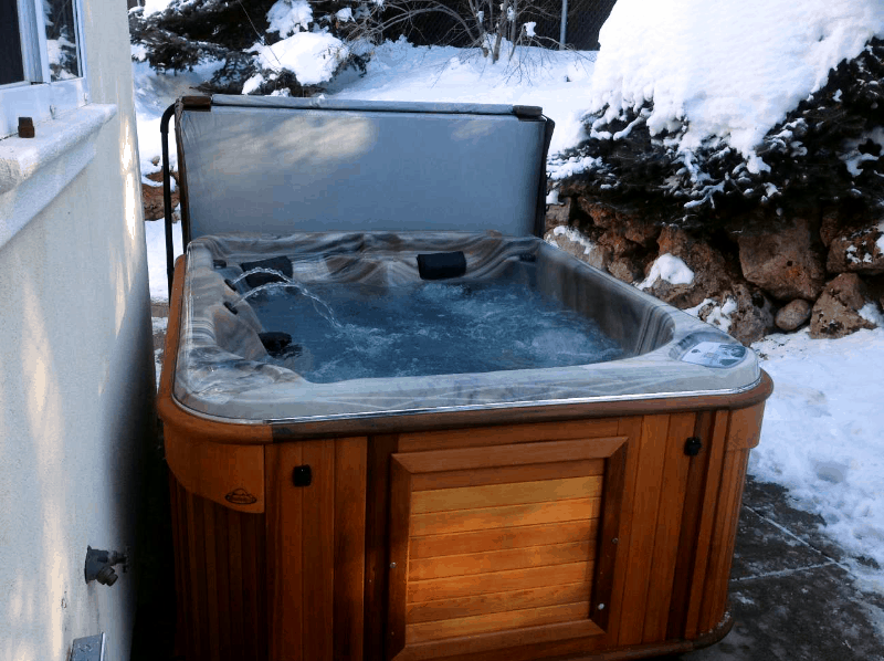 Arctic Spas Hot tub in the backyard in winter